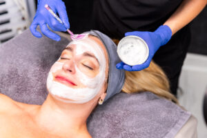A female patient receives our Karma Custom Facial. At Karma Beauty & Wellness, we combine traditional menopause treatments in Overland Park with aesthetic services to help patients feel radiant inside and out.